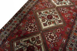 Backside of handmade 1950s Ghashghai rug showing knot structure and weave density