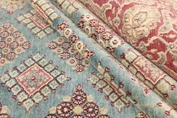 Corner detail of 1920s Hamedan rug showing border pattern and Wool pile