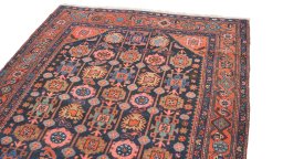 Surface texture of 1920s Hamedan rug with natural Wool and intricate pattern