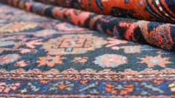 Close-up detail of 1920s Hamedan rug from Iran / Persia showing Wool weave