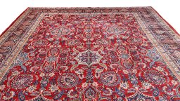 Surface texture of 1910s Hamedan rug with natural Wool and intricate pattern