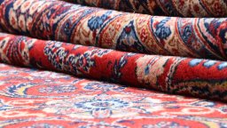 Full view of 1910s Hamedan rug from Iran / Persia, 490 × 338 cm in Red tones