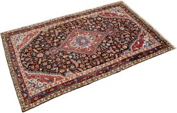 Corner detail of 1950s Hamedan rug showing border pattern and Wool pile