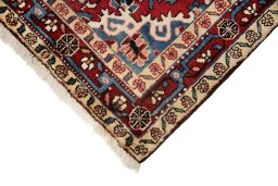 Backside of handmade 1950s Hamedan rug showing knot structure and weave density