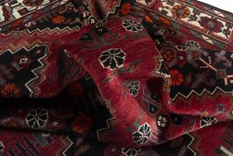 Corner detail of 2000s Hamedan rug showing border pattern and Wool pile