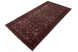 Corner detail of 2000s Hamedan rug showing border pattern and Wool pile