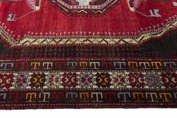 Corner detail of 2000s Hamedan rug showing border pattern and Wool pile