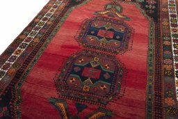 Backside of handmade 2000s Hamedan rug showing knot structure and weave density