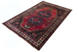 Corner detail of 2000s Hamedan rug showing border pattern and Wool pile
