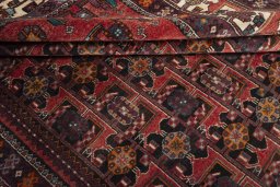 Corner detail of 2000s Hamedan rug showing border pattern and Wool pile