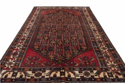 Surface texture of 2000s Hamedan rug with natural Wool and intricate pattern