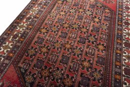 Backside of handmade 2000s Hamedan rug showing knot structure and weave density