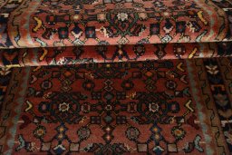 Full view of 2000s Hamedan rug from Iran / Persia, 330 × 83 cm in Red tones