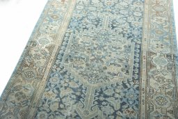 Backside of handmade 1950s Hamedan rug showing knot structure and weave density