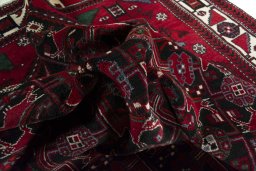 Corner detail of 2000s Hamedan rug showing border pattern and Wool pile