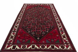 Surface texture of 2000s Hamedan rug with natural Wool and intricate pattern