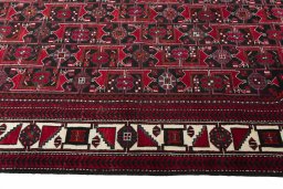 Close-up detail of 2000s Hamedan rug from Iran / Persia showing Wool weave