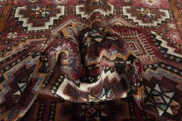 Corner detail of 2000s Hamedan rug showing border pattern and Wool pile