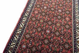 Backside of handmade New Hamedan rug showing knot structure and weave density