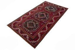 Corner detail of 2000s Hamedan rug showing border pattern and Wool pile