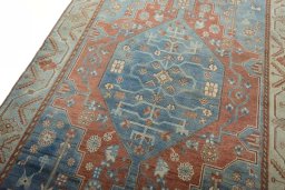 Backside of handmade 1950s Hamedan rug showing knot structure and weave density