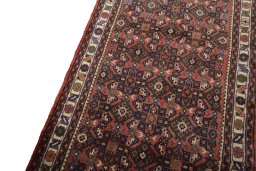 Backside of handmade New Hamedan rug showing knot structure and weave density