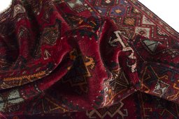 Corner detail of 1970s Hamedan rug showing border pattern and Wool pile