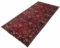 Corner detail of 1970s Hamedan rug showing border pattern and Wool pile