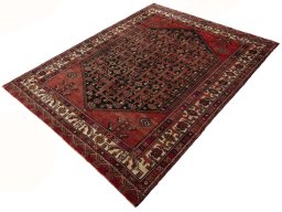 Corner detail of 1970s Hamedan rug showing border pattern and Wool pile
