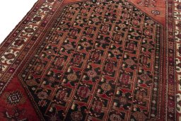 Backside of handmade 1970s Hamedan rug showing knot structure and weave density