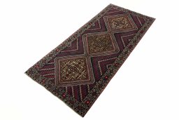 Corner detail of 2000s Hamedan rug showing border pattern and Wool pile