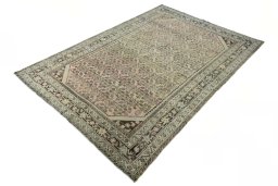 Corner detail of 1970s Hamedan rug showing border pattern and Wool pile