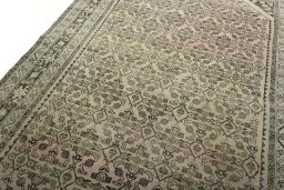 Backside of handmade 1970s Hamedan rug showing knot structure and weave density