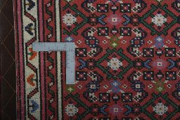 Corner detail of New Hamedan rug showing border pattern and Wool pile
