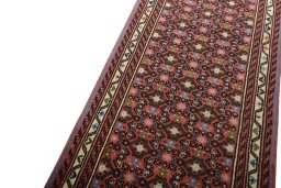 Backside of handmade New Hamedan rug showing knot structure and weave density