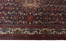 Corner detail of 2000s Hamedan rug showing border pattern and Wool pile