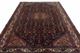 Surface texture of 2000s Hamedan rug with natural Wool and intricate pattern