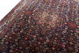 Backside of handmade 2000s Hamedan rug showing knot structure and weave density