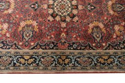 Corner detail of 2000s Hamedan rug showing border pattern and Wool pile
