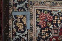 Backside of handmade 2000s Hamedan rug showing knot structure and weave density
