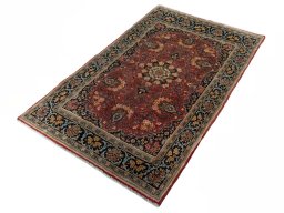 Corner detail of 2000s Hamedan rug showing border pattern and Wool pile