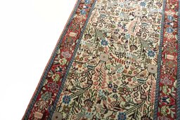 Backside of handmade New Hamedan rug showing knot structure and weave density