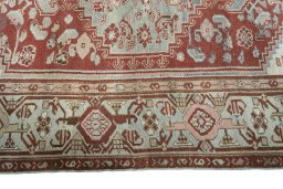 Corner detail of 1950s Hamedan rug showing border pattern and Wool pile