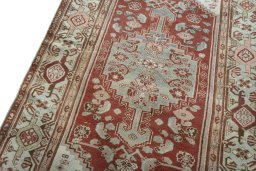 Backside of handmade 1950s Hamedan rug showing knot structure and weave density