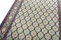 Backside of handmade 1970s Hamedan rug showing knot structure and weave density