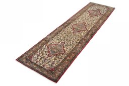 Corner detail of 2000s Hamedan rug showing border pattern and Wool pile