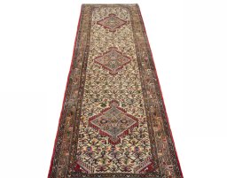 Surface texture of 2000s Hamedan rug with natural Wool and intricate pattern