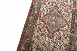 Backside of handmade 2000s Hamedan rug showing knot structure and weave density
