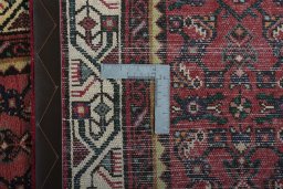 Close-up detail of 2000s Hamedan rug from Iran / Persia showing Wool weave
