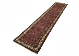Corner detail of 2000s Hamedan rug showing border pattern and Wool pile